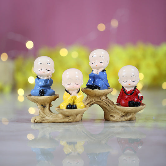 Wonderland ( Set of 4) 4 inch height Four sitting Monk on a tree bark