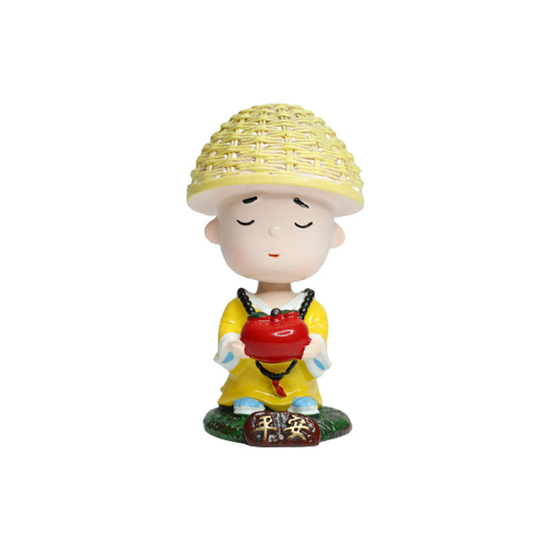 Wonderland Single piece Meditating monk with Apple shaking head| monk statue| home décor| gift articles | gift item